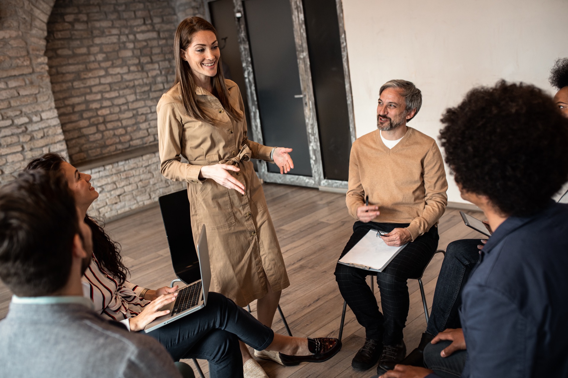 Group of diverse group of business people having a meeting while sitting in circle.